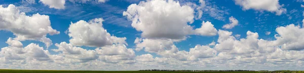 Panorama of the sky with clouds over fields and forest — Stock Photo, Image