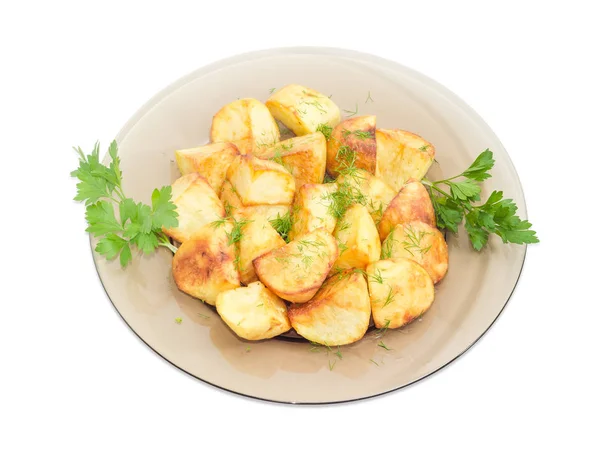 Patatas fritas con eneldo y perejil en plato de vidrio oscuro — Foto de Stock