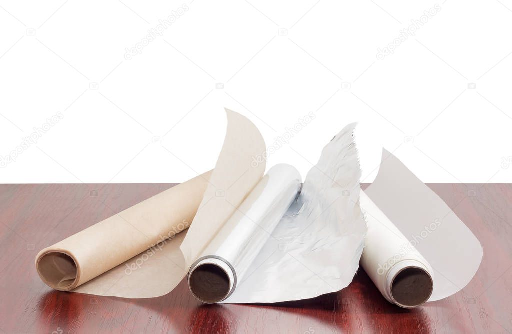 Rolls of parchment paper and aluminum foil for household use