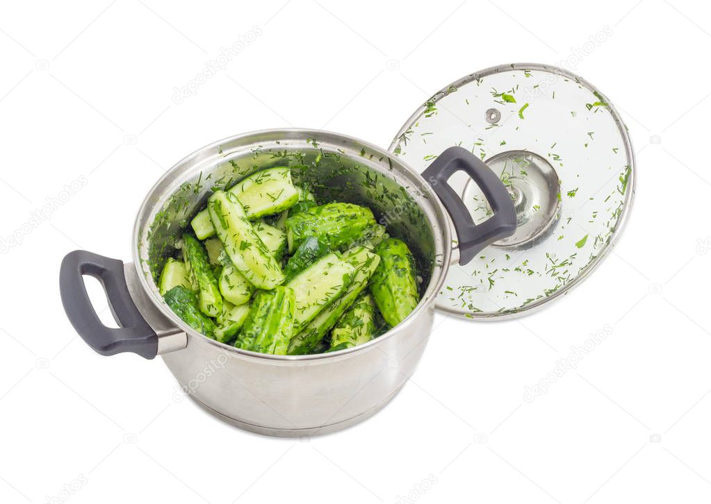 Lightly salted cucumbers in the stainless steel saucepot
