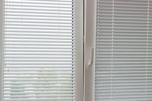 White Venetian blinds on a modern plastic window — Stock Photo, Image