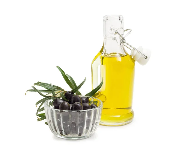 Aceitunas negras, aceite de oliva y rama de olivo — Foto de Stock