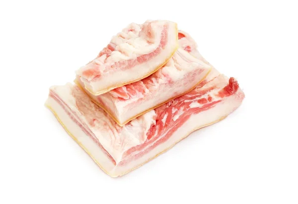 Pezzi di pancetta di maiale con pelle sotto sale — Foto Stock