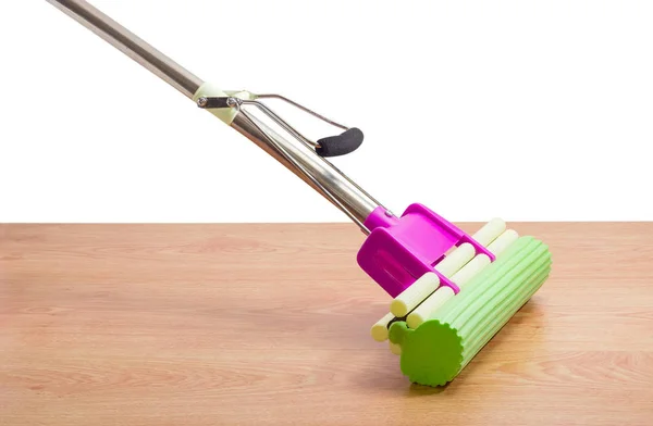 Sponge mop with clip on a wooden floor — Stock Photo, Image