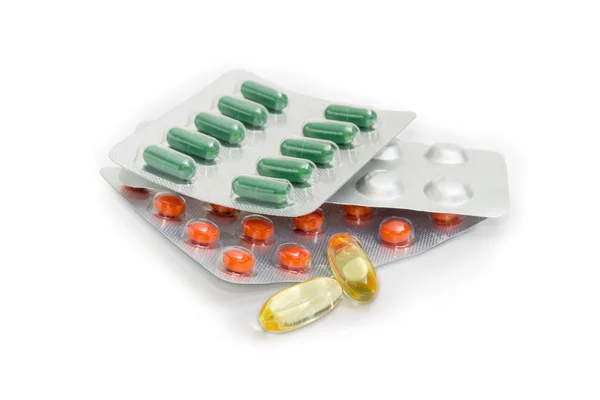Envases blíster y cápsulas translúcidas de diferentes medicamentos —  Fotos de Stock