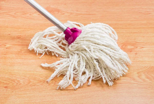 Classic mop on a wooden floor — Stock Photo, Image