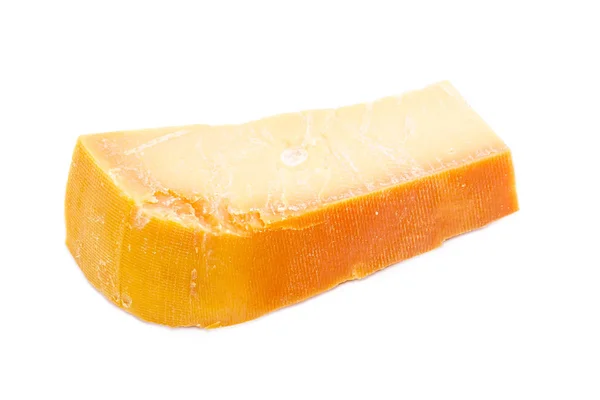 Шматок голландського твердий сир Бемстер внесено до крупним планом — стокове фото