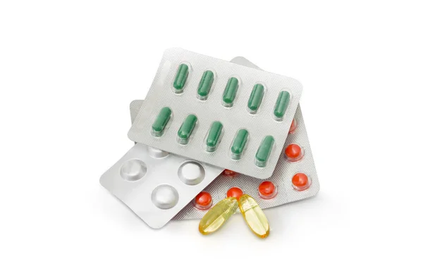 Translucent capsules and blister packs of different medications — Stock Photo, Image