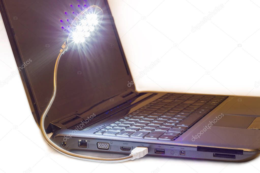 Luminous LED USB lamp connected to notebook 