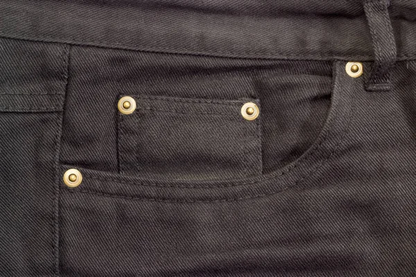 Fragment of the top of the black jeans — Stock Photo, Image