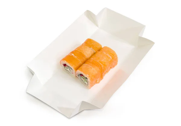 Sushi au saumon dans une boîte en carton pour plats à emporter — Photo