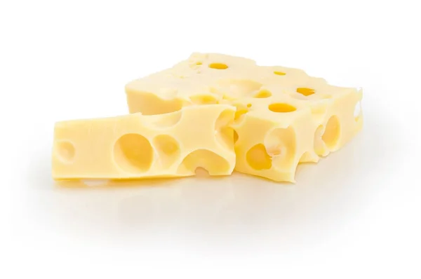 Zwei Stück Schweizer Käse in verschiedenen Größen — Stockfoto