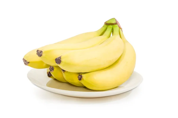 Cluster of bananas on a white dish — Stock Photo, Image