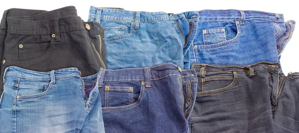 Diversi jeans diversi su sfondo bianco — Foto Stock