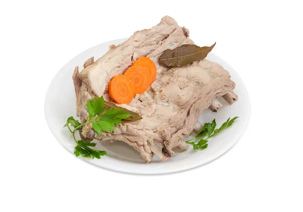 Stück der gekochten Schweinerippchen auf dem weißen Teller — Stockfoto