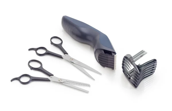 Two various hairdressers scissors and electric hair clipper — Stock Photo, Image