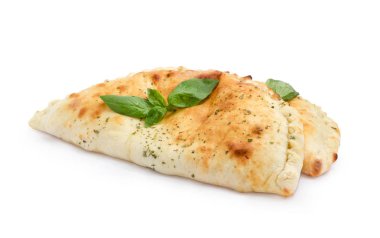 Two cooked calzone with basil twigs on a white background clipart