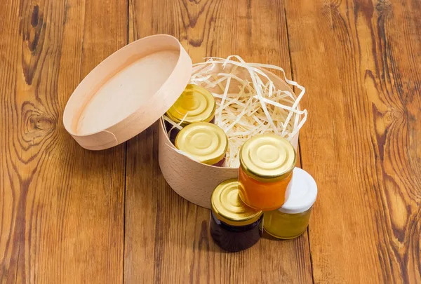 Set of various jam in small jars in wooden box — Stock Photo, Image