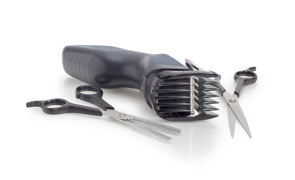 Electric hair clipper and two different hairdressers scissors — Stock Photo, Image