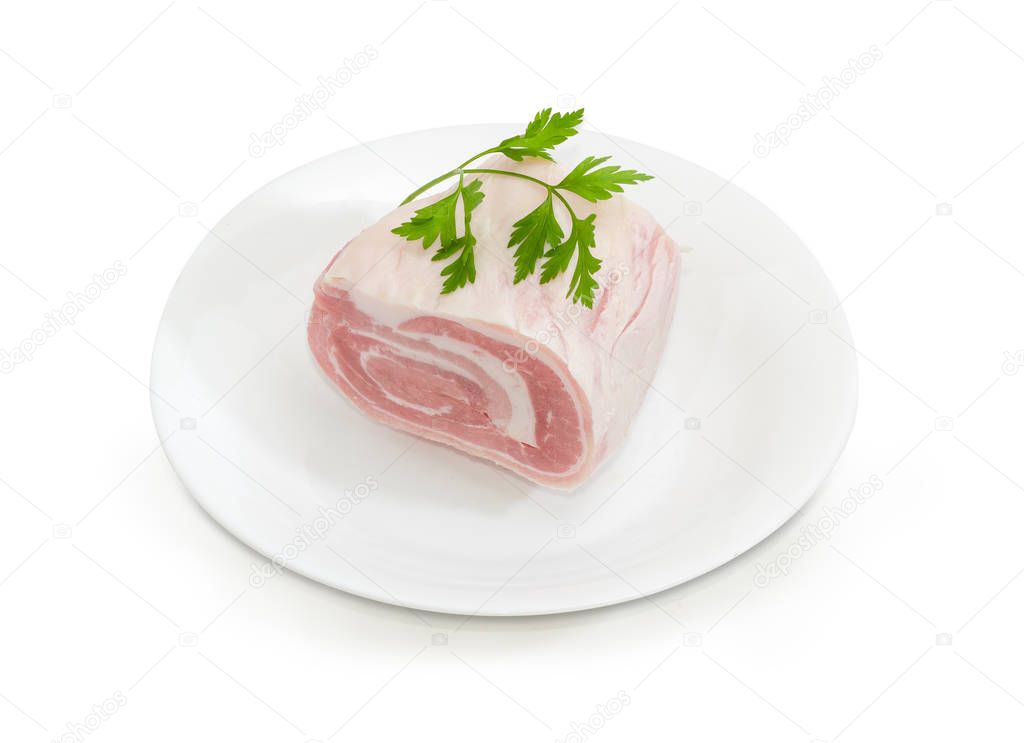 Uncooked streaky pork belly on a white dish