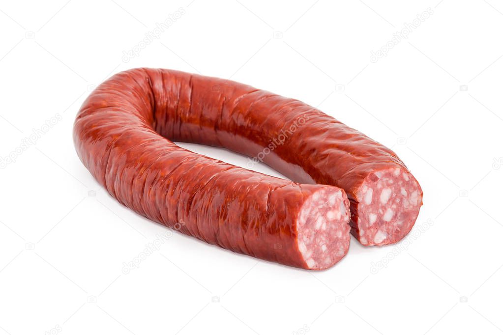 Partly cut smoked sausage on a white background