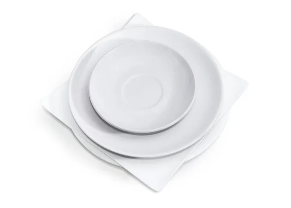 Montón de platos blancos vacíos de diferentes formas y tamaños — Foto de Stock