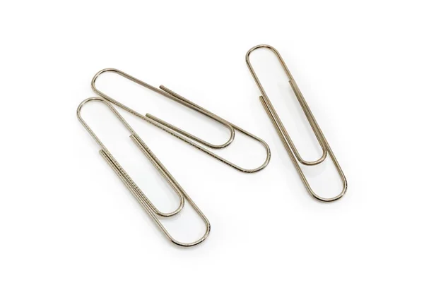 Three steel paper clips on a white background — Stock Photo, Image