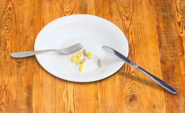 Çanak, çatal, bıçak diyet takviyeleri ile Tablet ve kapsüller