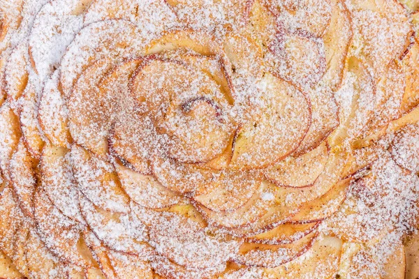 Fondo de pastel de manzana al horno espolvoreado con azúcar en polvo — Foto de Stock