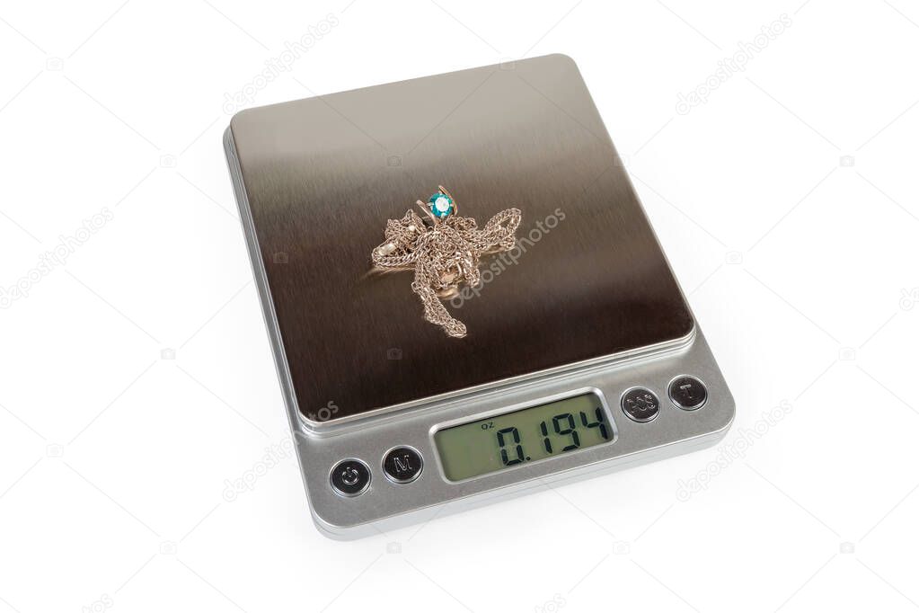 Jewelry on professional digital table top scales on white background