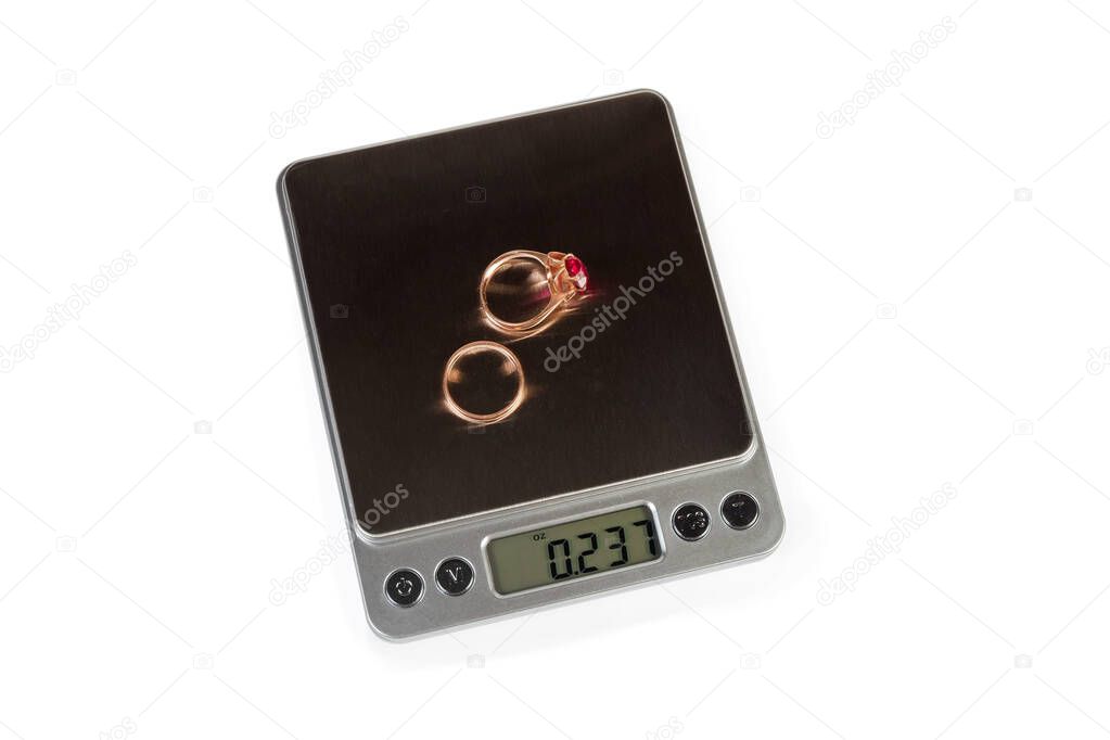 Top view of professional digital table scales with gold jewelry