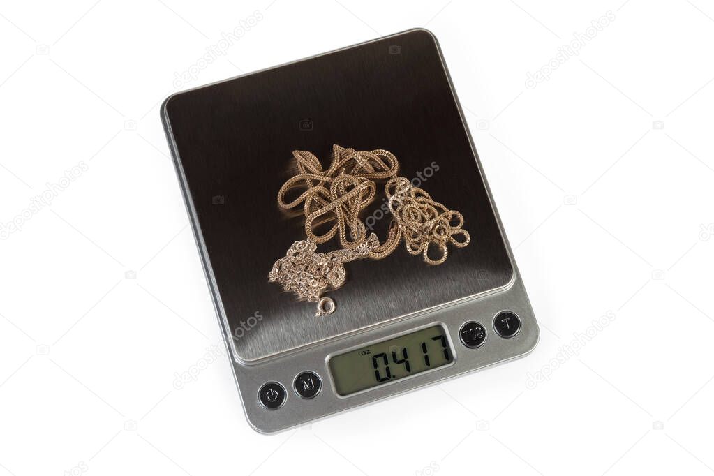 Top view of professional digital table scales with silver jewelry