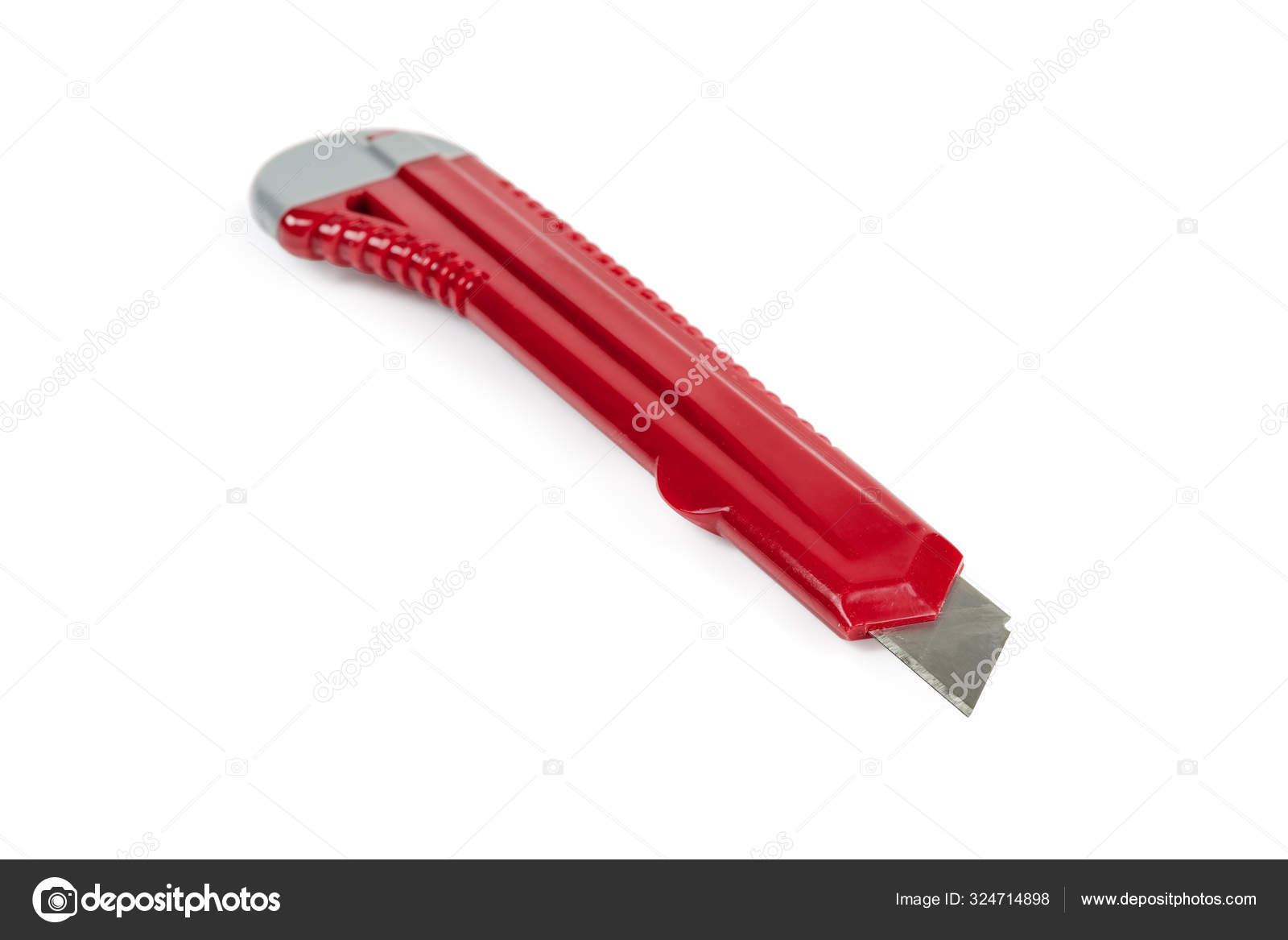 Red stationery cutter knife closeup on a white background — Stock