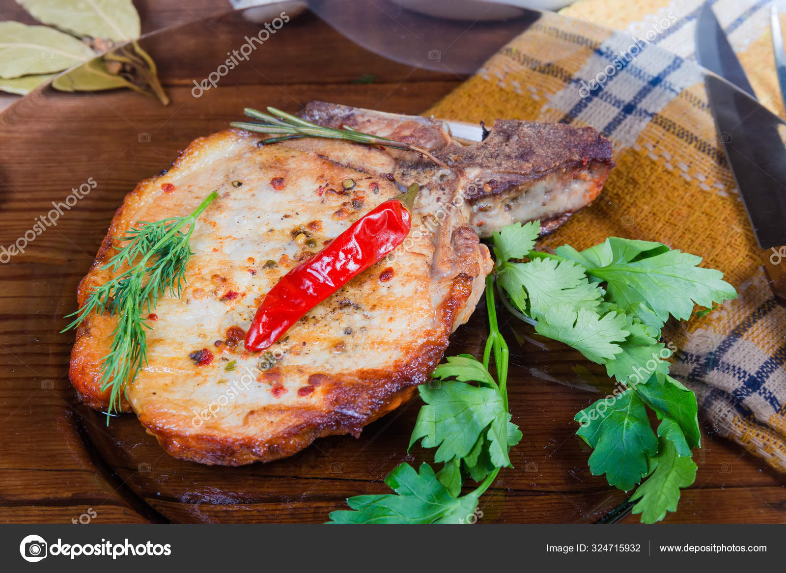 Grilled pork loin chop bonein on dish closeup — Stock Photo © anmbph