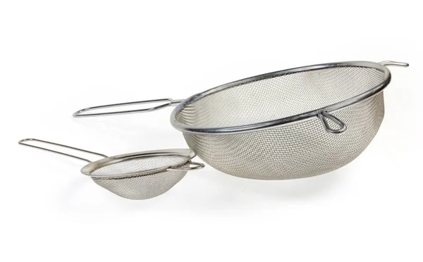 Round stainless steel sieve different sizes on a white backgroun — Stock Photo, Image