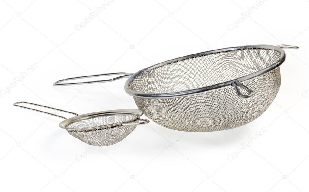Round stainless steel sieve different sizes on a white backgroun