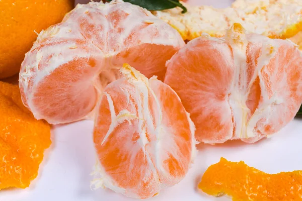Peeled mandarin orange divided into segments close-up