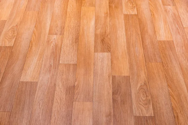 Fragment of vinyl flooring with wooden planks embossed imitation — Stock Photo, Image