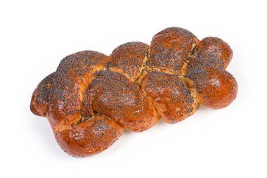 Sweet braided bread sprinkled with poppy seeds on white background
