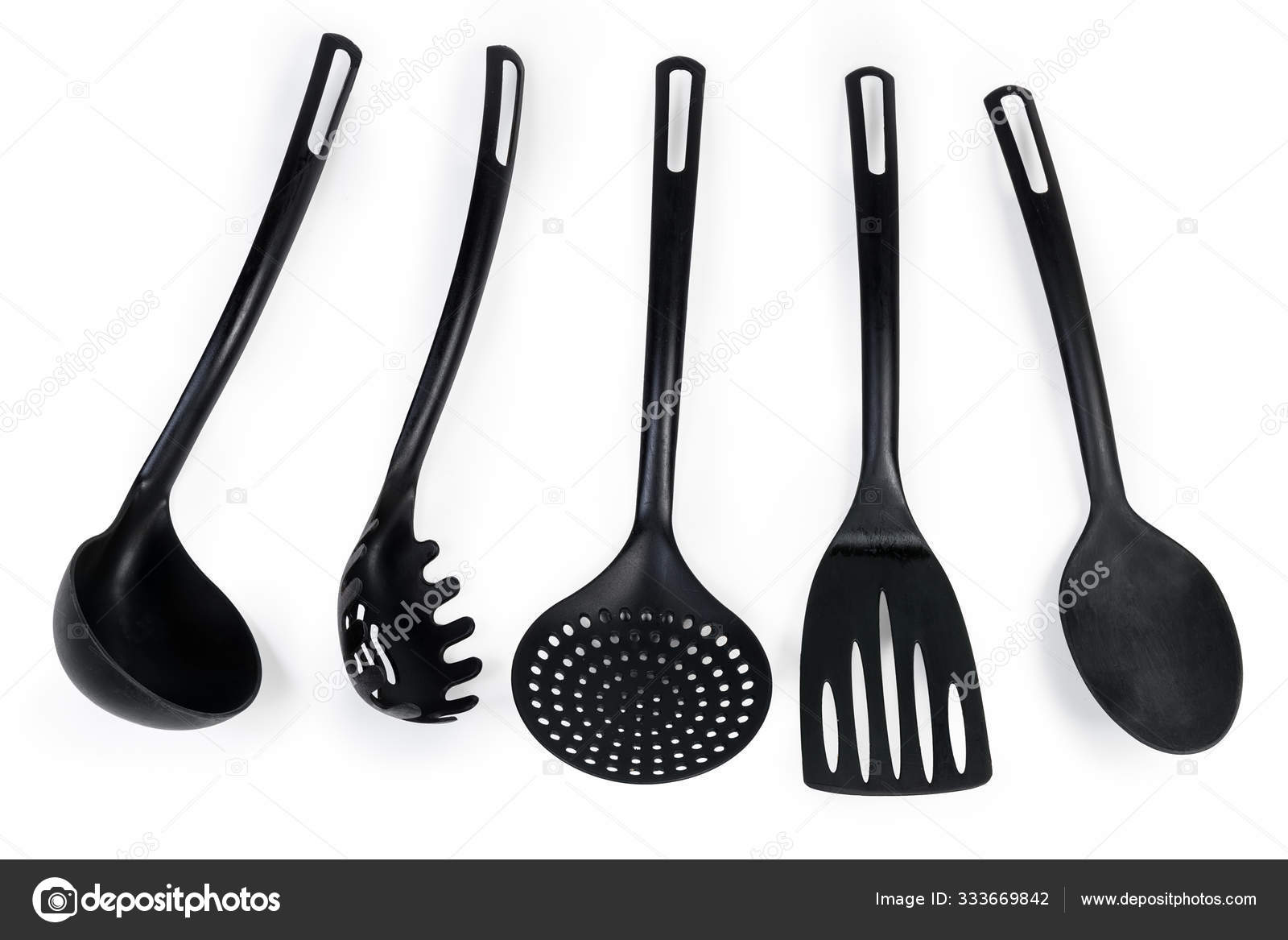 Different plastic cooking utensils on a white background Stock Photo by  ©anmbph 333669842