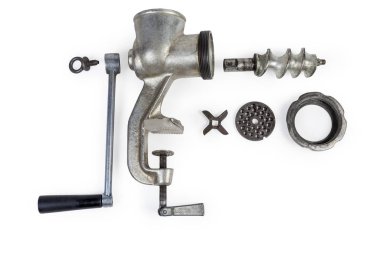 Disassembled hand meat grinder and its components on white background clipart