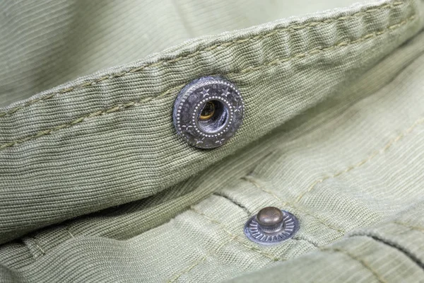 Unbuttoned snap button fastener on outerwear closeup in selective focus — Stock Photo, Image