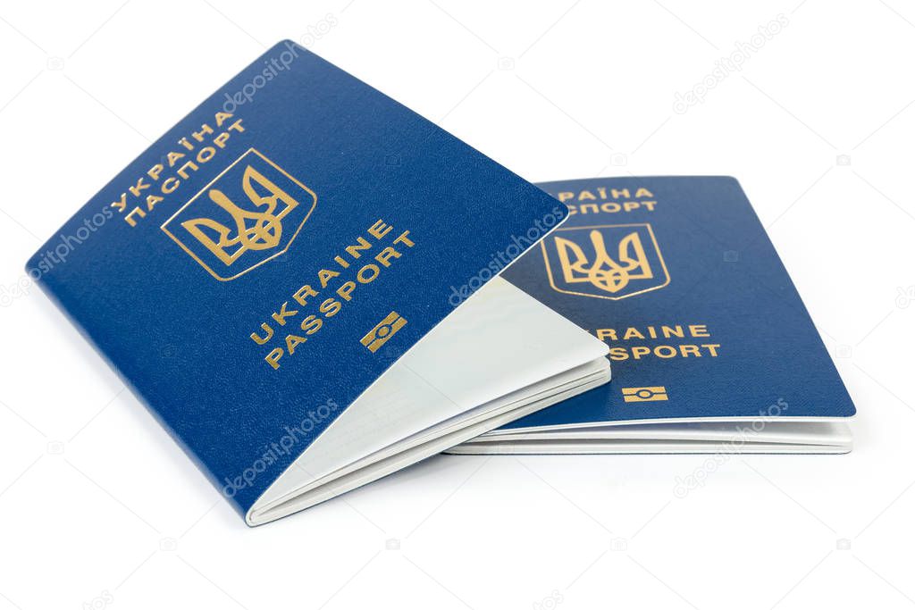 Two ordinary biometric Ukrainian passports on a white background