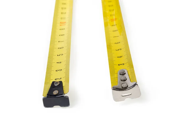 Flexible metal metric rulers of two tape measures close-up — 图库照片