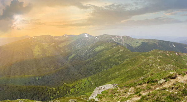 Mountain Chornohora range in summer at sunset. Panoramic view from the peak Pip Ivan, Carpathian Mountains, Ukraine