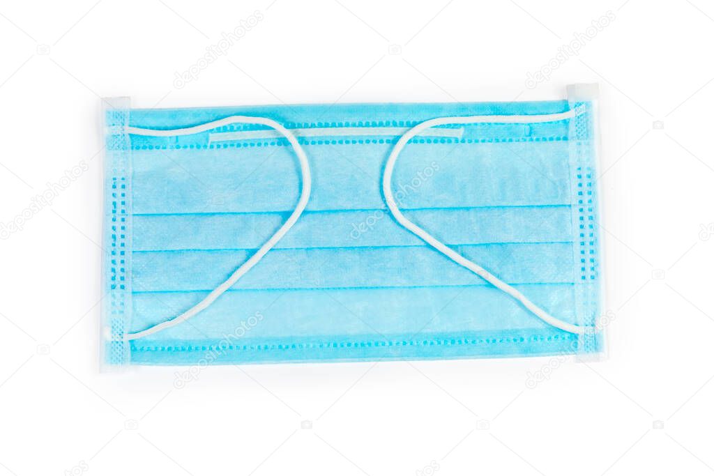 Light blue disposable medical face three-ply mask with metal wire for securely cover nose on a white background, top view
