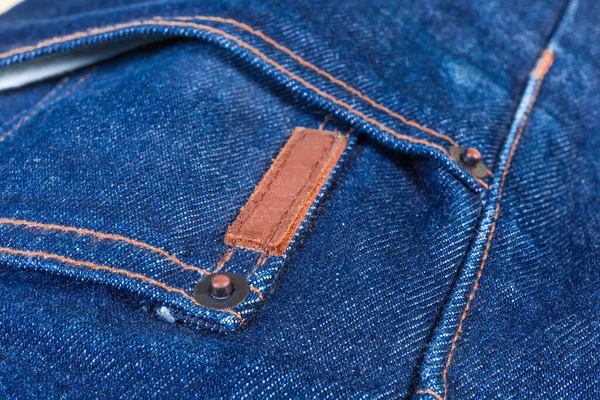 Zak Blauwe Jeans Met Koperen Klinknagels Een Blanco Klein Dik — Stockfoto