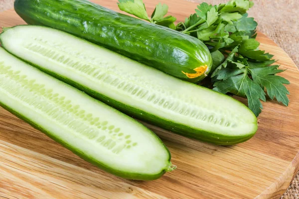 One Whole Two Halves Long Green Smooth Skinned Cucumbers Wooden — Stock Photo, Image