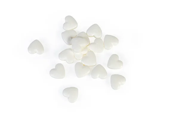 Pílulas Forma Coração Branco Espalhadas Superfície Branca Vista Superior Close — Fotografia de Stock