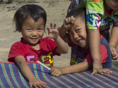 Children playing, Chiang Rai, Thailand clipart